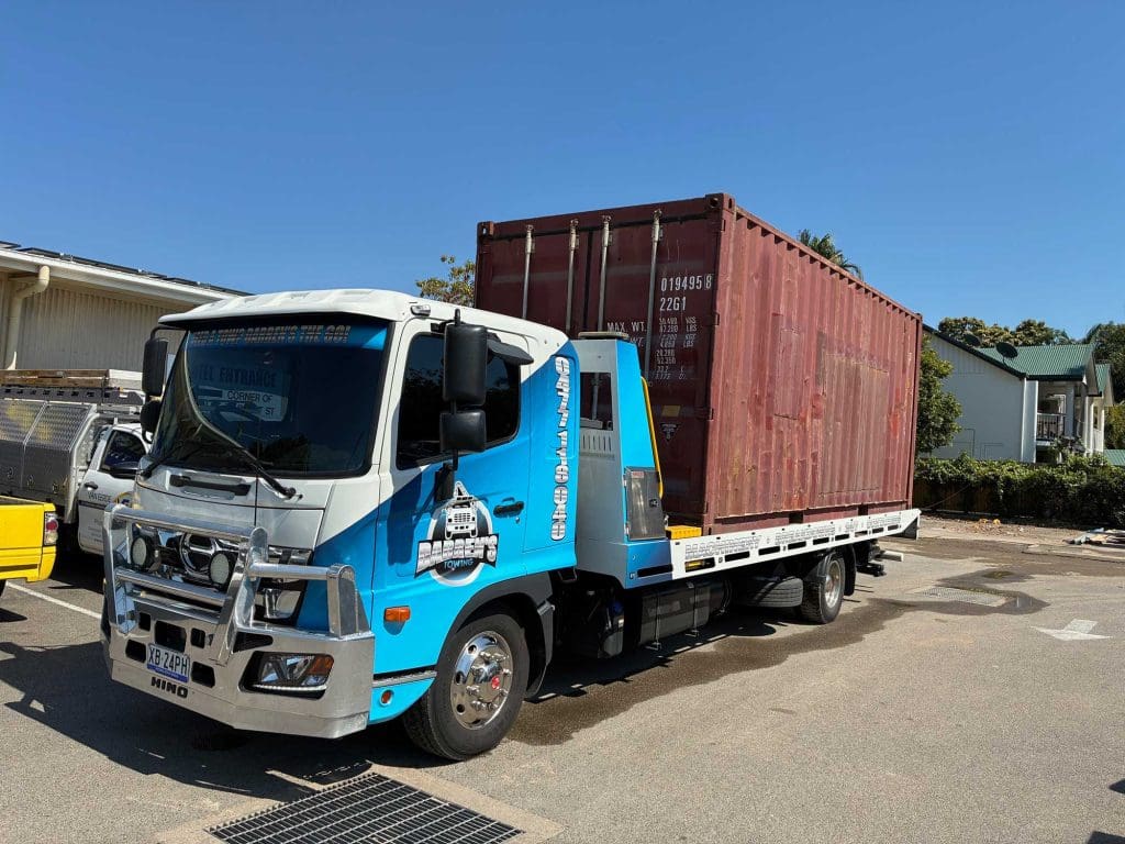 Darren’s Towing transporting a shipping container in Townsville.