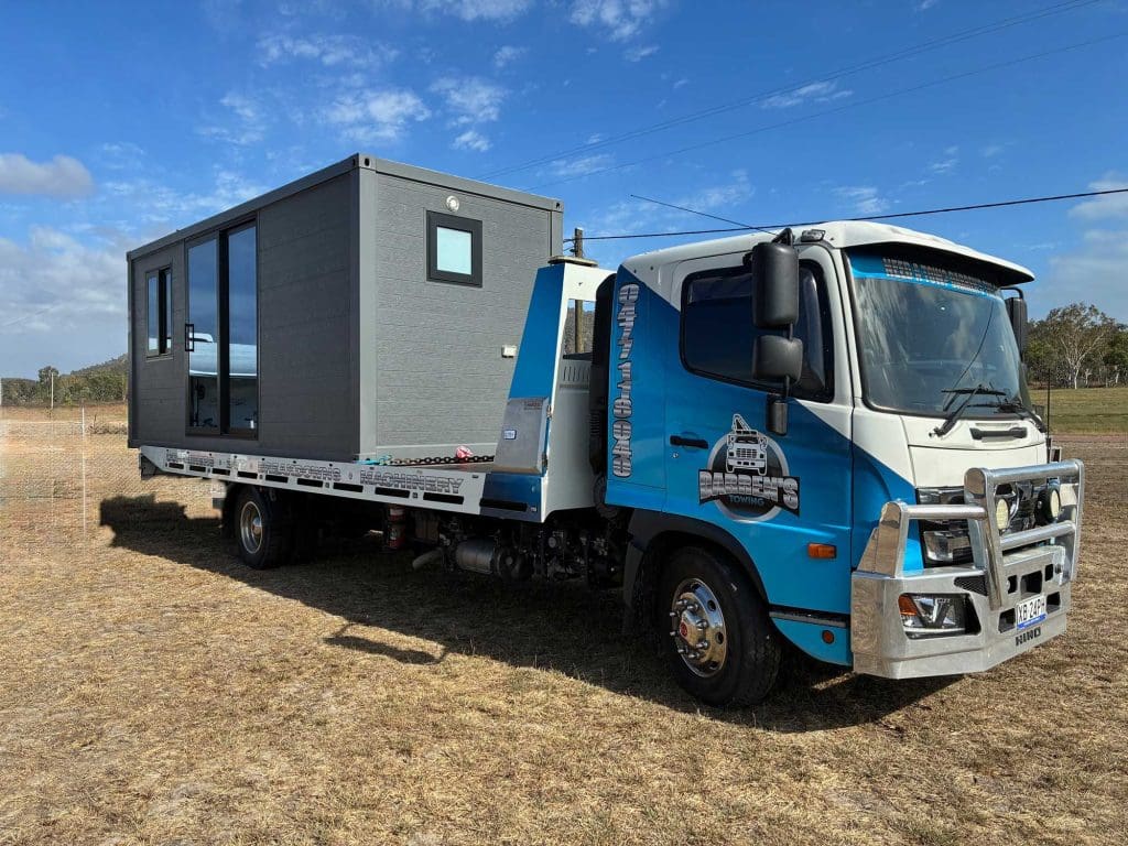 Darren’s Towing transporting a portable office block in Townsville.